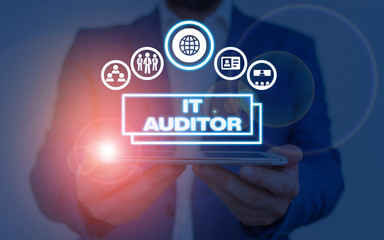 Writing note showing It Auditor. Business concept for demonstrating authorized to review and verify...