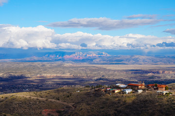Fototapeta premium Looking down on the red rocks of Sedona and the beautiful Verde Valley from Jerome.
