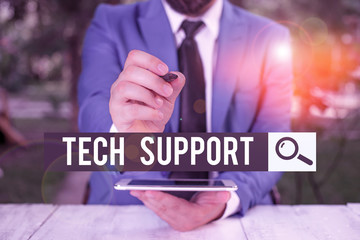 Handwriting text Tech Support. Conceptual photo advising and troubleshooting service provided by a analysisufacturer Businessman pointing with pen in empty copy space