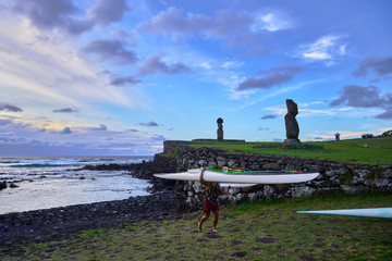 A rapa nui with a traditional kayac in Ahu Ko Te Riku . Easter Island . Chile