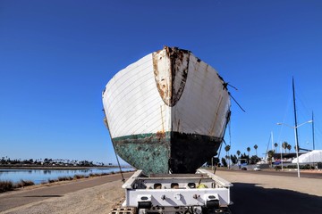 abandoned wrecked ship sitting on a trailer