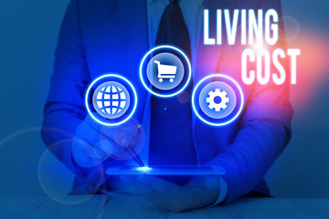 Conceptual hand writing showing Living Cost. Concept meaning the amount of money that a...