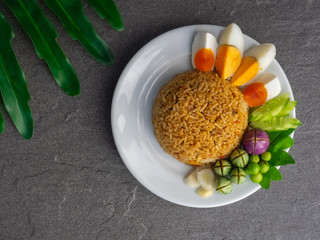 Shrimp paste sauce fried rice with boiled egg and vegetables on white plate, Thai menu call Naam Phrik Lohng Rua, Healthy Thai food.