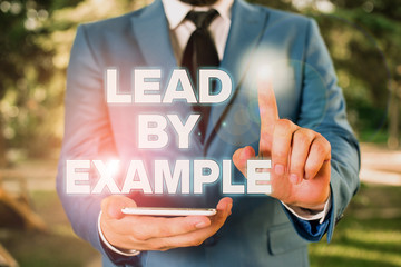 Conceptual hand writing showing Lead By Example. Concept meaning Be a mentor leader follow the...