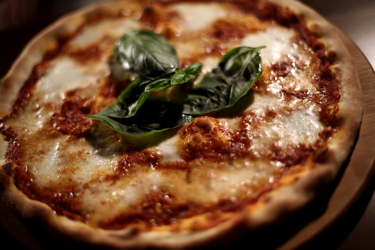 Italian pizza with mozzarella parmesan tomato basil salami