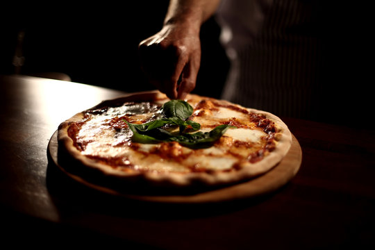 Italian pizza with mozzarella parmesan tomato basil salami