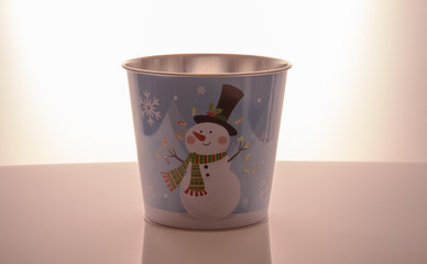 Metal zink Christmas buckets snowman blue background 
