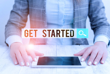 Handwriting text Get Started. Conceptual photo Begin an important period in one s is life or career Begin a task Business woman sitting with mobile phone on the table