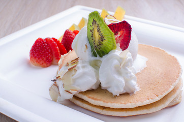 pankaques with ice cream, fruit and chocolate sauce