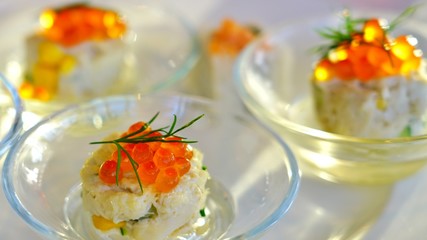 Small dish of fresh crab tartare with salmon roe and dill