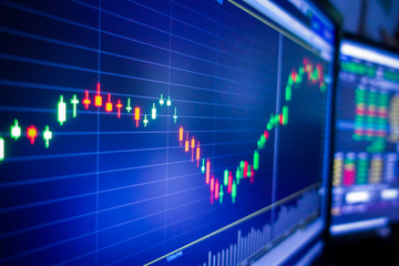 Blue stock exchange market graph on LED screen for business analysis. Finance and economic graphs.