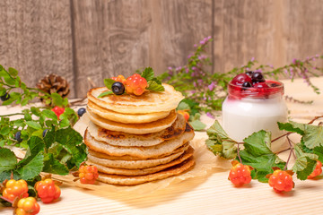 Pancakes with black currant berries and yogurt