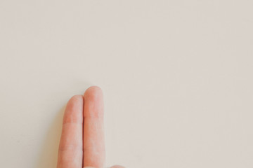 hand on a white background: two fingers. the concept of manifestation of emotions, gestures