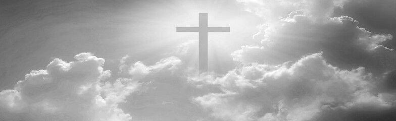 Christian cross appeared bright in the sky with soft fluffy clouds, white, beautiful colors. With the light shining as hope, love and freedom in the sky background
