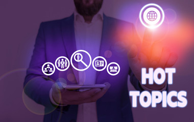 Writing note showing Hot Topics. Business concept for subject that a lot of showing are arguing and discussing