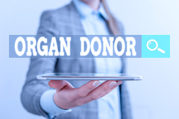 Writing note showing Organ Donor. Business concept for the act of donating an organ to a demonstrating needed a transplant Business concept with mobile phone and business woman