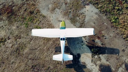 Small aircraft starts moving in a top view