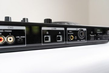 Obraz premium Cable to connect professional DJ midi controller to audio mixer.Concert equipment for home party.Disc jockey technology to mix digital music tracks.RCA audio cables