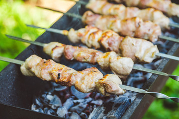Meat grilling on the brazier. Selective focus.