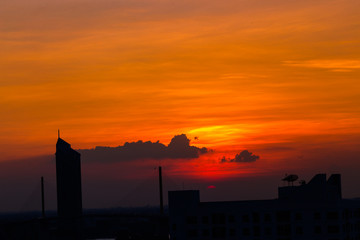 Fototapeta premium panoramic high-angle evening background of the city view,with natural beauty and blurred sunsets in the evening and the wind blowing all the time,showing the distribution of city center accommodation