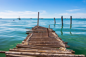 The wood bridge on the sea in Pattaya bay, Thailand.