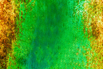 Rough and battered green paint texture on a rusted metal surface showing scratches, dents and rust patches
