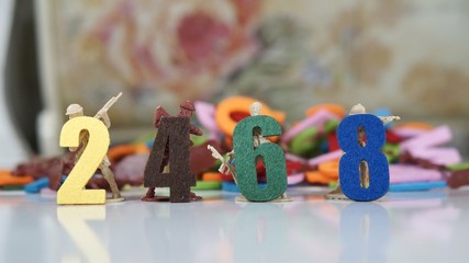 Image of even numbers with toy soldiers at background