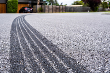 Tyre track on asphalt from hard braking - shallow focus - 304290636