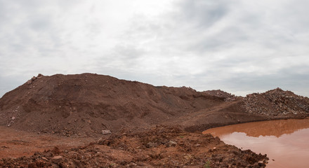 Sa soil hillside and mud puddle landscape view, panorama