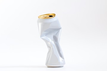 squeezed white aluminum beer can on white background