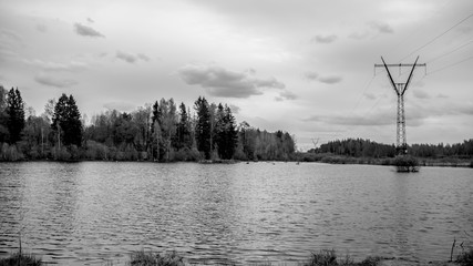 power line on the river going into the forest