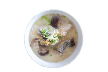 Rice porridge with fish and mushroom in a bowl, top view isolated on white background