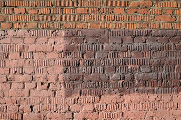 Weathered old brick wall painted brown paint. Abstract background