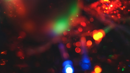 Christmas colorful New Year's Bokeh neon lights. Abstract Blurred photo background with blinking...
