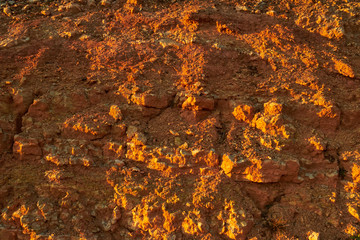 Rocky mountain slope at sunset.