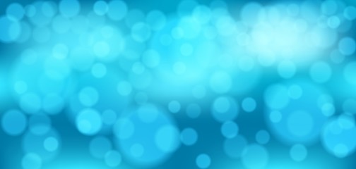 Blue bokeh background. Christmas glowing lights with sparkles. Holiday decorative effect.