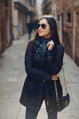 Naklejka premium female tourist walking around and exploring venice in the early spring