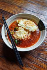 Delicious Yunnan style spicy rice noodle soup with fried egg for breakfast at Shuhe ancient town.  