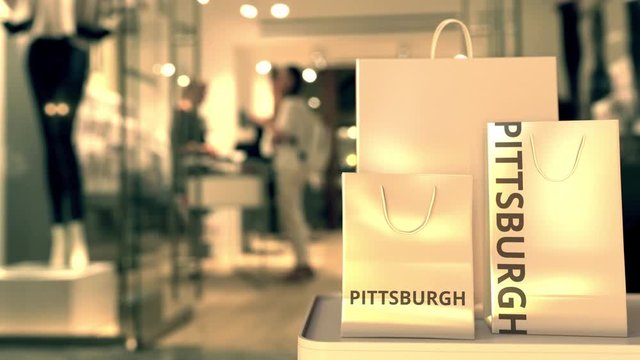 Bags with Pittsburgh text. Shopping in the United States related 3D animation