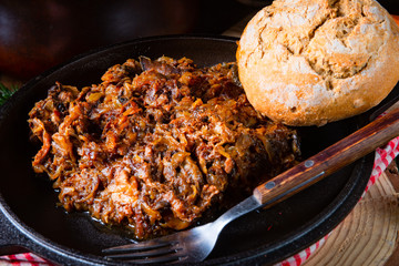 Polish bigos with sausage and dried plum