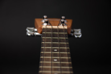 Ukulele on a black background