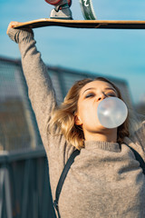 Urban stylish young girl. Outdoors emotional portrait of active woman model. Healthy lifestyle....