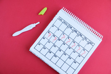 Missed period marked on calendar, pregnancy test. Woman's health and delay in menstruation.