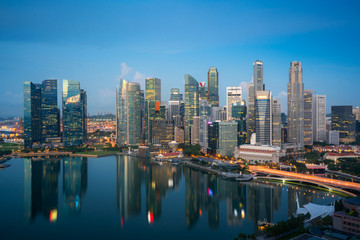 Fototapeta na wymiar Panorama of Singapore business district skyline and skyscraper at twilight night at Marina Bay, Singapore. Asian tourism, modern city life, or business finance and economy concept.