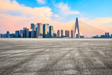 Sunset empty asphalt road and city skyline in Chongqing