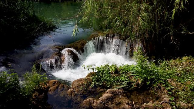 Little waterfall, frash cold water falling down