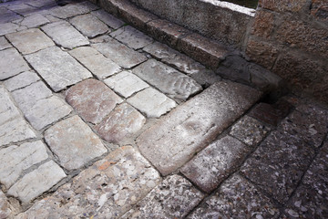 Fototapeta premium A heritage walking stone path at Old Town of Lijiang.It is the historical center if Lijiang City,in Yunnan,China.It is also a UNESCO World Heritage Side. 