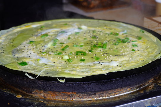 Jianbing Is A Traditional Chinese Street Food Similar To Crepes. It Is A Type Of Bing Generally Eaten For Breakfast Or Snack.