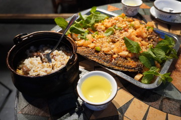 Naxi style grilled fish with wild mushroom rice at Shuhe ancient town restaurant.