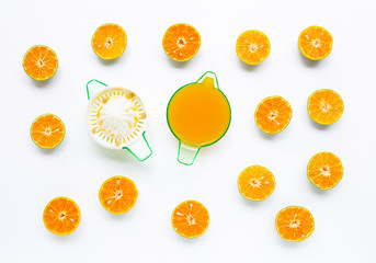 Citrus orange juicer with oranges fruit on white